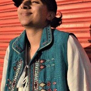 Blue vest with colored emroidery